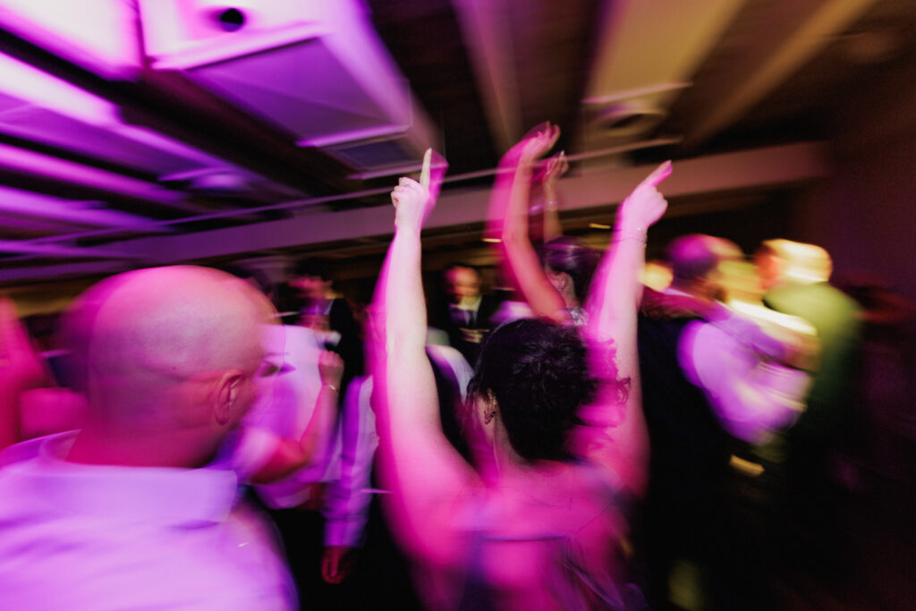 Wedding guests on the dancefloor at Inn on the Twenty windows Room.