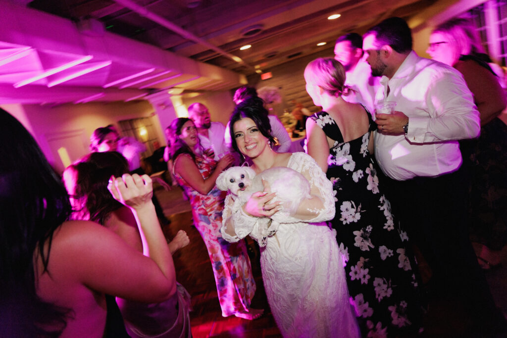 A small dog out on the dancefloor vibing to the music at Inn on the Twenty